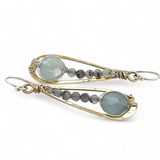 Aquamarine coins and black tourmaline quartz faceted gemstones in brass drop earrings with sterling silver wire.