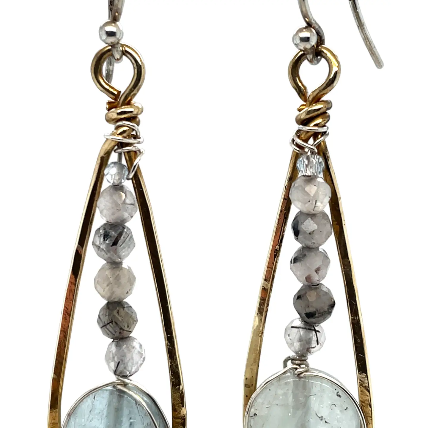 Aquamarine coins and black tourmaline quartz faceted gemstones in brass drop earrings with sterling silver wire.