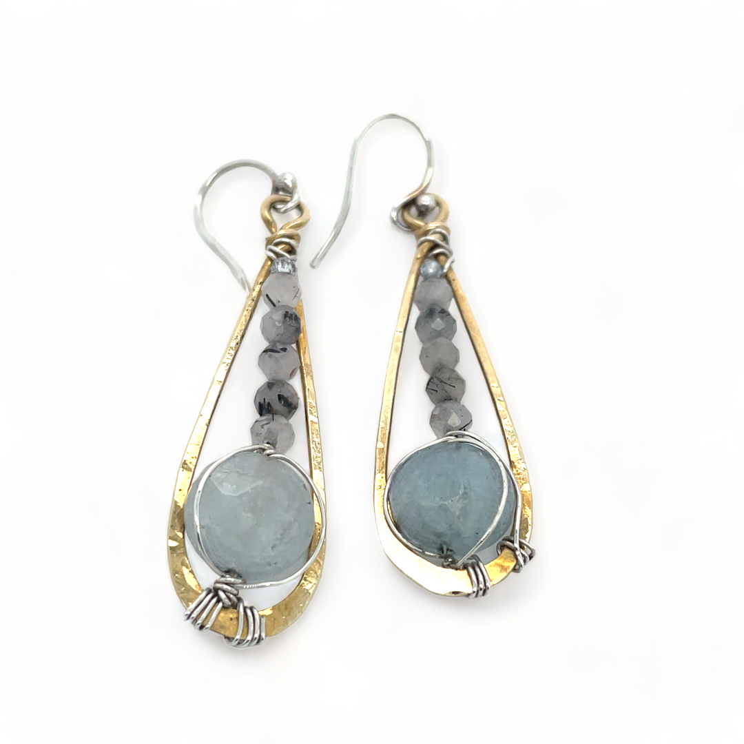 Aquamarine coins and black tourmaline quartz faceted gemstones in brass drop earrings with sterling silver wire.
