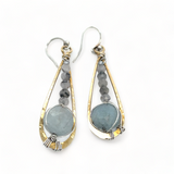 Aquamarine coins and black tourmaline quartz faceted gemstones in brass drop earrings with sterling silver wire.