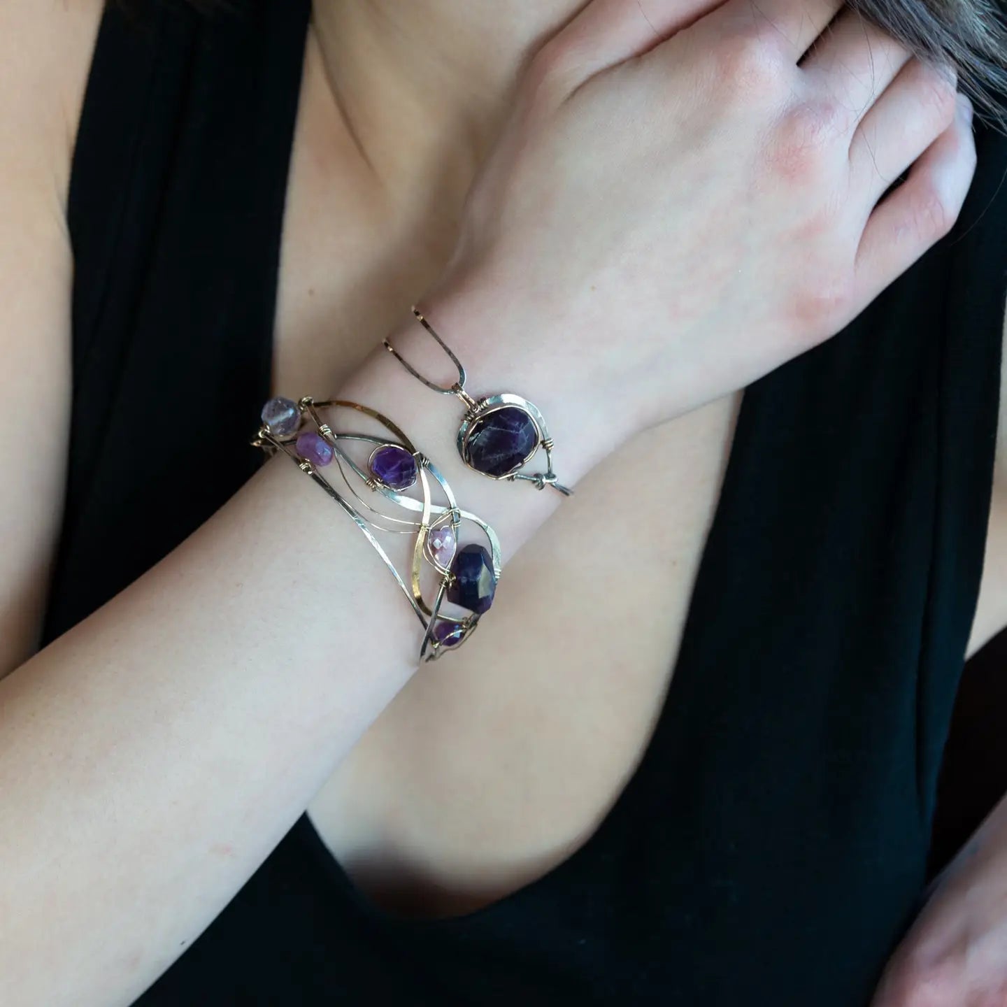 Sterling silver cuff bracelet with a large faceted dark purple amethyst gemstone nugget wrapped in bronze wire