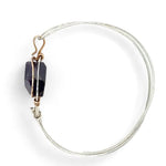Sterling silver cuff bracelet with a large faceted dark purple amethyst gemstone nugget wrapped in bronze wire
