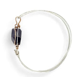 Sterling silver cuff bracelet with a large faceted dark purple amethyst gemstone nugget wrapped in bronze wire