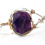 Sterling silver cuff bracelet with a large faceted dark purple amethyst gemstone nugget wrapped in bronze wire