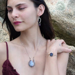 Sterling silver cuff bracelet with a large faceted dark purple amethyst gemstone nugget wrapped in bronze wire