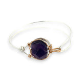 Sterling silver cuff bracelet with a large faceted dark purple amethyst gemstone nugget wrapped in bronze wire