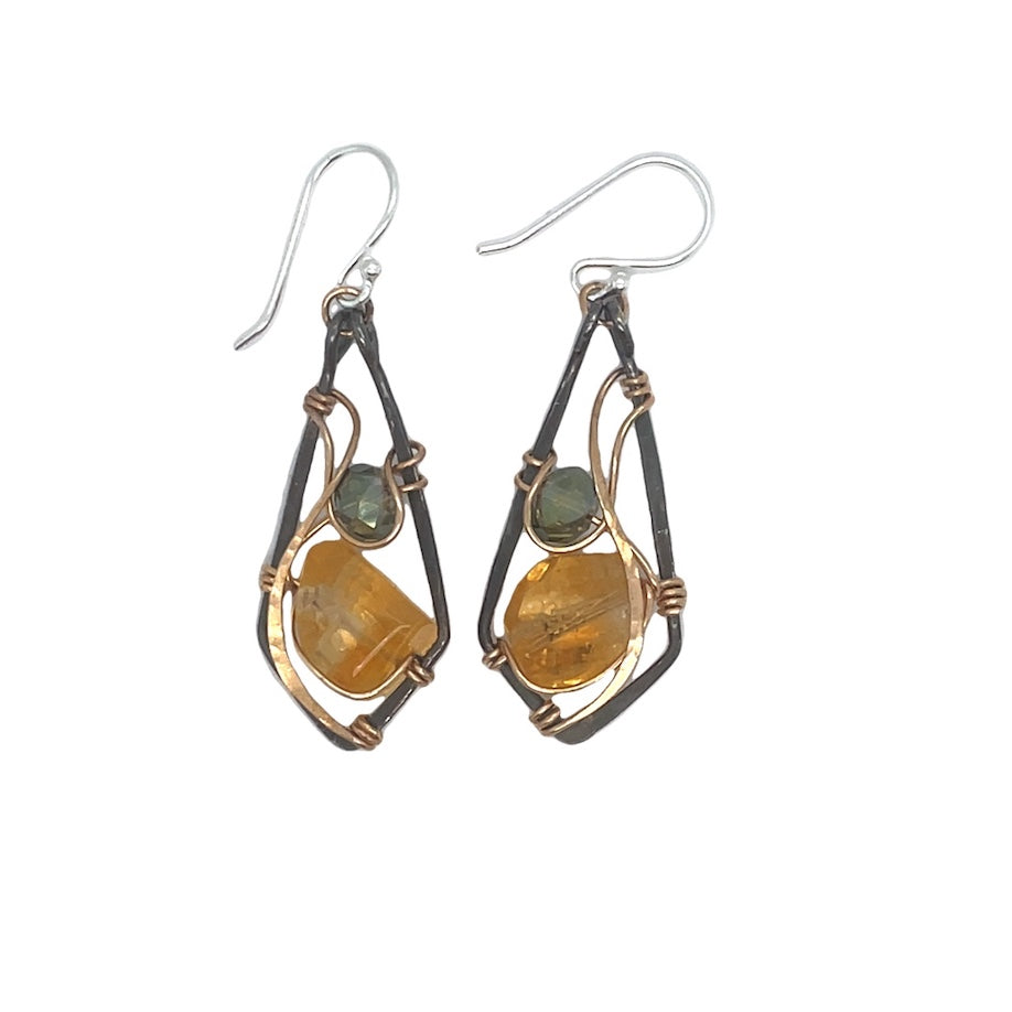 Citrine nugget gemstone and green crystal sit inside wraps of bronze hammered wire within a darkened sterling silver arrowhead shaped earring