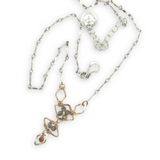 Gold filled hammered diamond shapes filled with rutilated quartz faceted gemstones to form a y shape necklace
