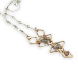Gold filled hammered diamond shapes filled with rutilated quartz faceted gemstones to form a y shape necklace