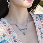 Moss aquamarine, crystal, and green cat's eye faceted gemstones, sparkly sterling links and sterling silver tube chain to form a double layered necklace