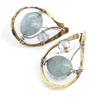 Aquamarine smooth oval gemstone earrings with a faceted blue crystal and wrapped in hammered sterling silver in a tree stamped brass drop earring with built in earring hooks that wear like a post earring