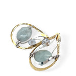 Aquamarine smooth oval gemstone earrings with a faceted blue crystal and wrapped in hammered sterling silver in a tree stamped brass drop earring with built in earring hooks that wear like a post earring