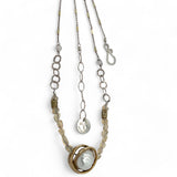 a fresh water pearl is held in a brass knot pendant with opal nugget gemstones on gold filled and sterling silver dash chain necklace