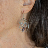Oxidized sterling silver channel hoop earrings embellished with labradorite gemstones and plum colored crystal drops