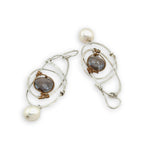 Mauve moonstone faceted coin gemstones are wrapped in brass twist wire attached to a sterling silver earring with a fresh water pearl dangle
