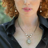 Sterling silver handmade knot pendant holding a lustrous moonstone slab hanging from a ladle of fresh water pearl and moonstone gemstones on a double up darkened sterling silver chain necklace