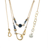 Handmade hammered brass teardrops and straps mixed with pyrite faceted gemstones  to form this double layered necklace on gold filled chain