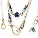 Handmade hammered brass teardrops and straps mixed with pyrite faceted gemstones  to form this double layered necklace on gold filled chain