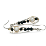 Green goldstone and round fresh water pearls are wrapped in gold filled wire attached to small sterling silver hammered drop earrings