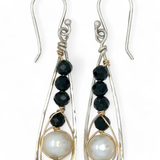 Green goldstone and round fresh water pearls are wrapped in gold filled wire attached to small sterling silver hammered drop earrings