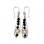 Green goldstone and round fresh water pearls are wrapped in gold filled wire attached to small sterling silver hammered drop earrings