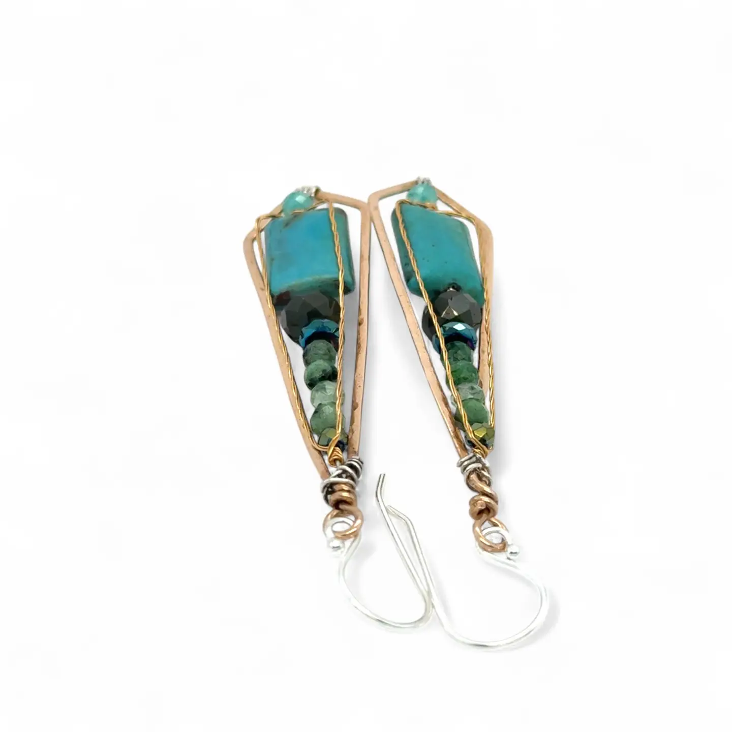 Turquoise smooth rectangles topped with crystal, pyrite, and ruby zoisite gemstones in a long bronze diamond earrings with brass twist accent