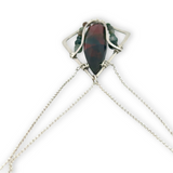 A hammered sterling silver diamond pendant hold a bloodstone faceted skinny drop accented with fancy jasper gemstones, held on a sterling silver dainty double chain necklace