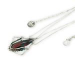 A hammered sterling silver diamond pendant hold a bloodstone faceted skinny drop accented with fancy jasper gemstones, held on a sterling silver dainty double chain necklace