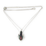 A hammered sterling silver diamond pendant hold a bloodstone faceted skinny drop accented with fancy jasper gemstones, held on a sterling silver dainty double chain necklace