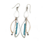 A pair of dangling earrings with sterling silver and bronze semi-circle elements, accented with tiny faceted aqua cat's eye gemstones and labradorite dangles