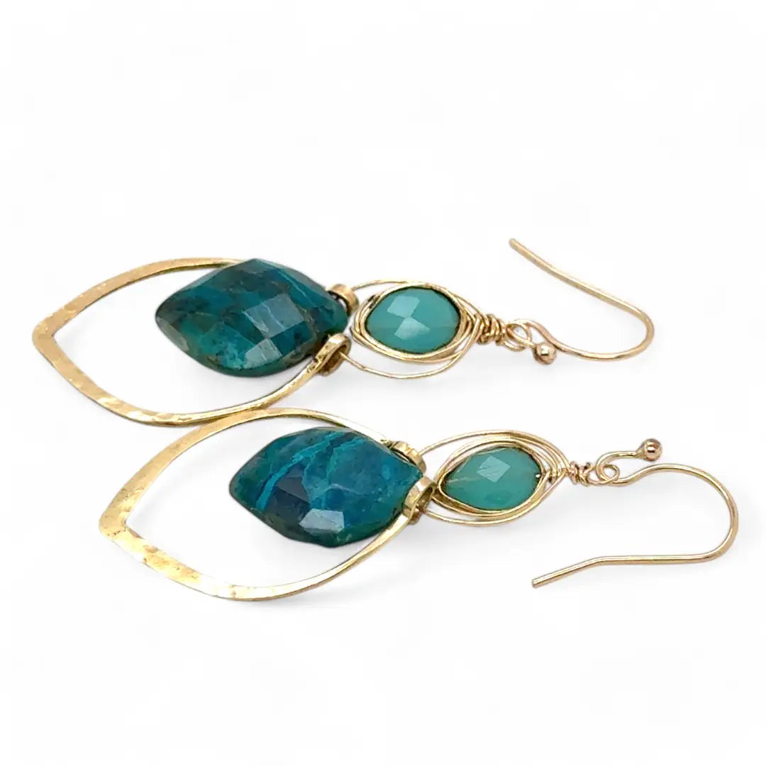 A pair of gold-colored brass earrings with a double drop design, featuring blue green chrysocolla marquise gemstones and chalcedony wrapped in gold filled wire