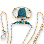 Brass circular pendant with square top chrysocolla drop, green apatite, and faceted chrysocolla gemstones on gold filled wire and chain necklace