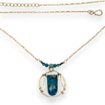 Brass circular pendant with square top chrysocolla drop, green apatite, and faceted chrysocolla gemstones on gold filled wire and chain necklace