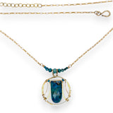 Brass circular pendant with square top chrysocolla drop, green apatite, and faceted chrysocolla gemstones on gold filled wire and chain necklace