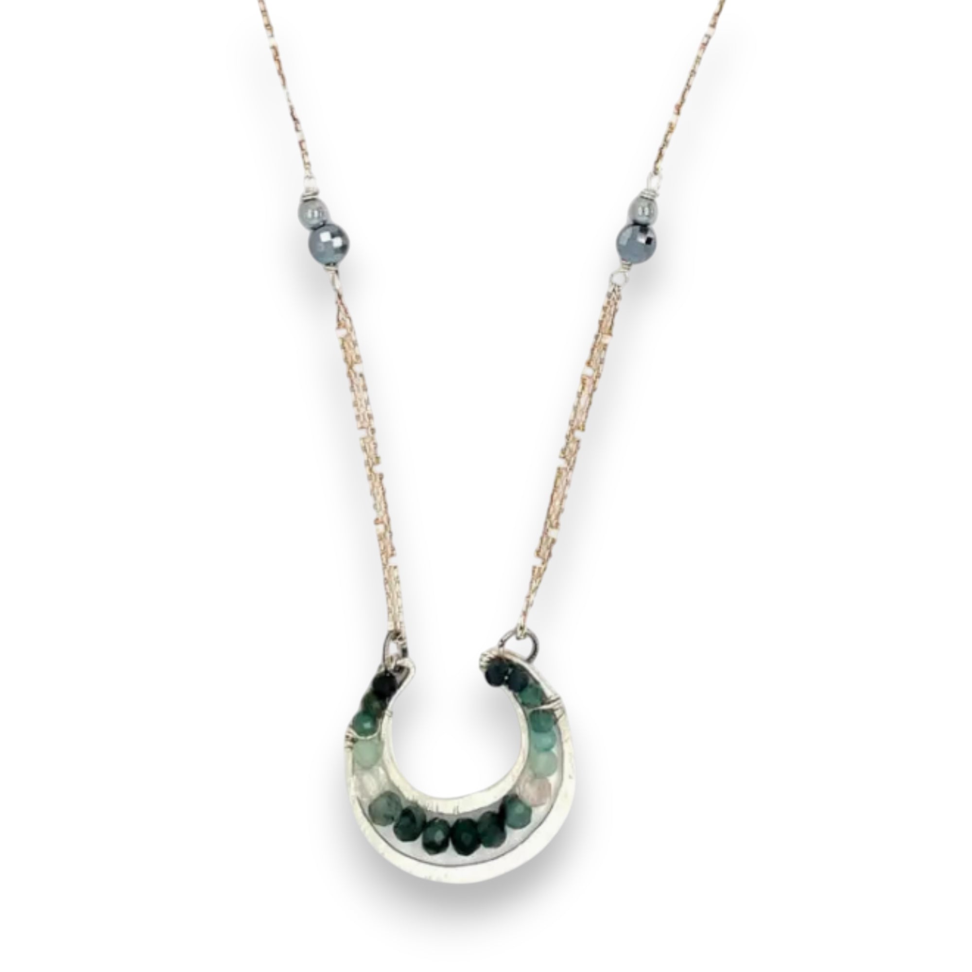 Mini sterling silver horseshoe shaped pendant filled with emerald, amazonite, blue tourmaline, and green amethyst gemstones, with a gold filled and sterling dot chain with pyrite accents necklace
