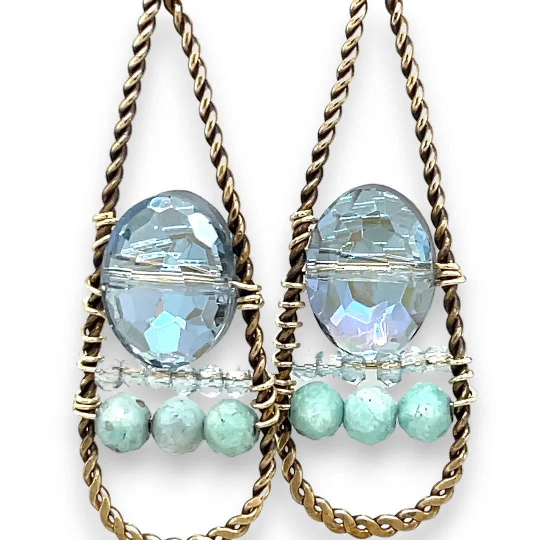 A pair of twisted brass drop earrings featuring blue crystal, amazonite and apatite gemstones 