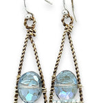 A pair of twisted brass drop earrings featuring blue crystal, amazonite and apatite gemstones 