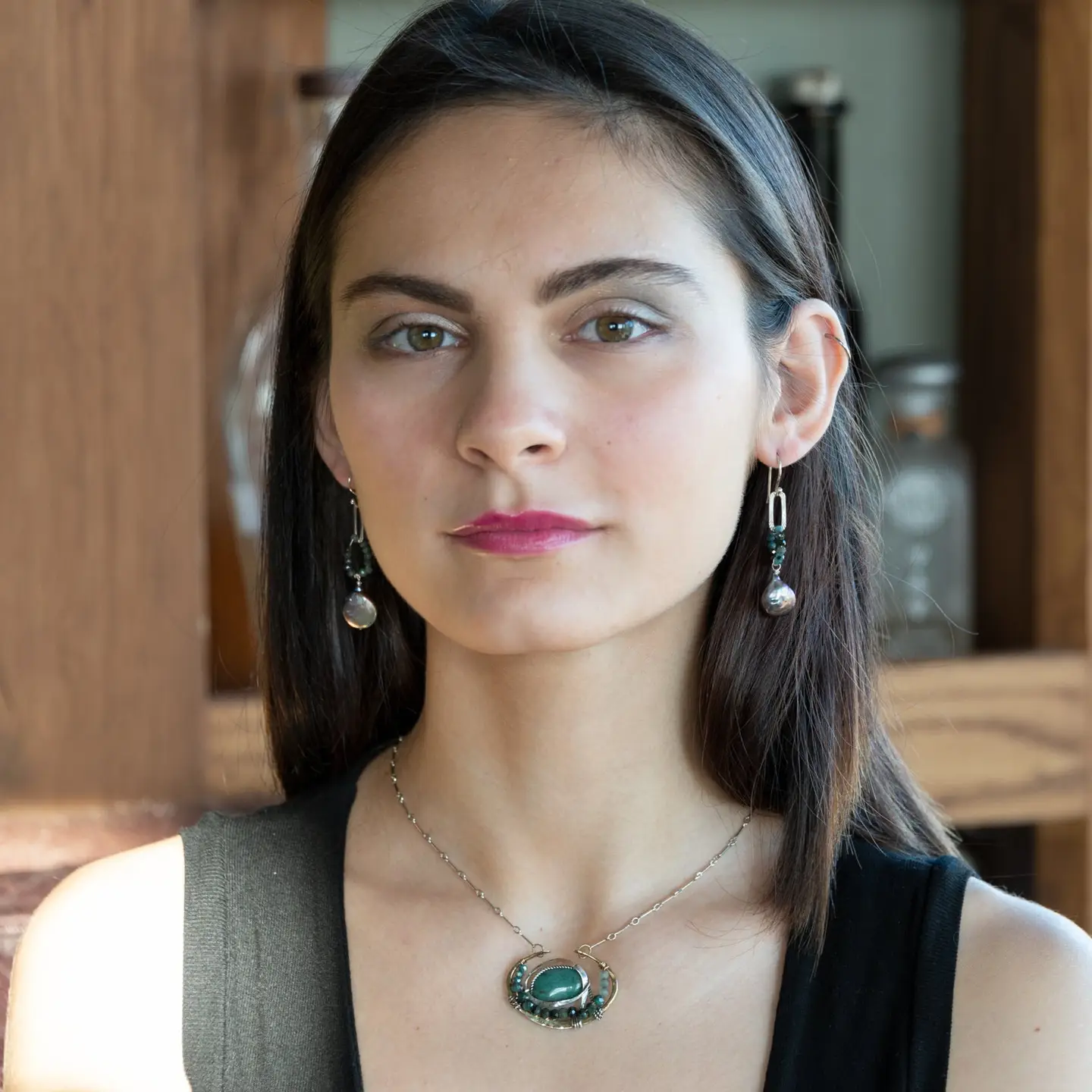 Blue tourmaline gemstones with a peacock fresh water pearl drop on textured sterling silver link earrings