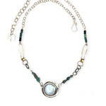 A sterling silver chain link necklace with a blue purple fresh water pearl coin in a hammered silver knot pendant, accented with blue opal and blue tourmaline gemstones