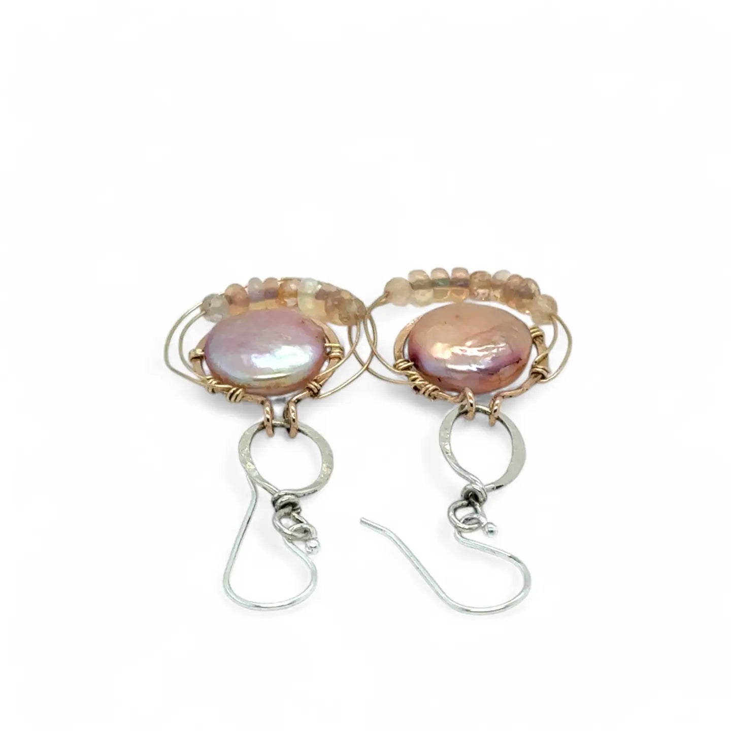 pink fresh water pearl coins are held in bronze rings on hammered sterling silver drops with rings of gold filled wire holding pink opal and peach cat's eye gemstone earrings
