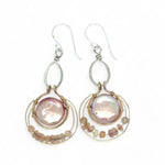 pink fresh water pearl coins are held in bronze rings on hammered sterling silver drops with rings of gold filled wire holding pink opal and peach cat's eye gemstone earrings