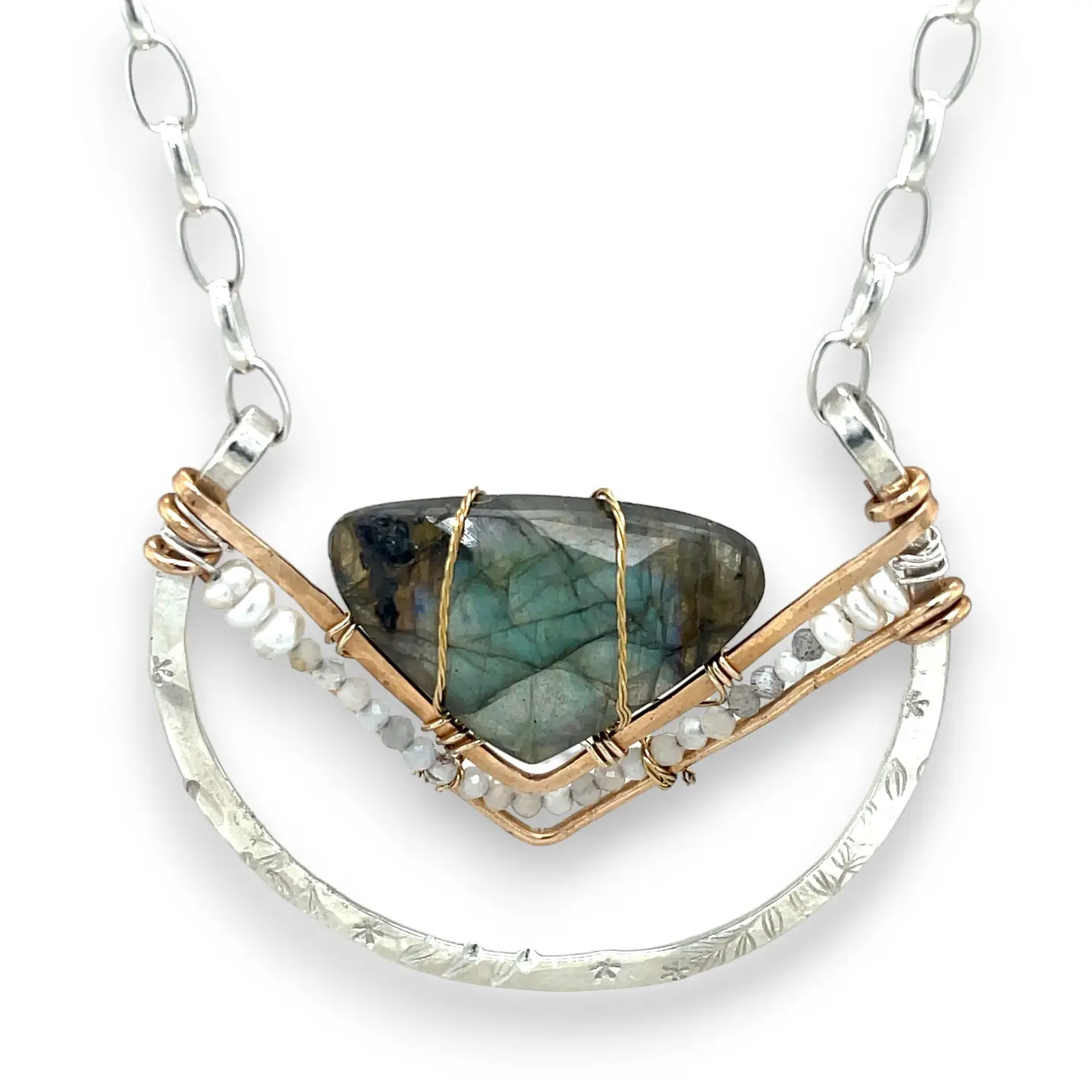 Leaf stamped sterling silver bowl shaped pendant with bronze v shape accents. A fan shaped flashy labradorite gemstone with fresh water pearl and micro-faceted gemstones and a sterling silver chain