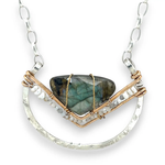Leaf stamped sterling silver bowl shaped pendant with bronze v shape accents. A fan shaped flashy labradorite gemstone with fresh water pearl and micro-faceted gemstones and a sterling silver chain