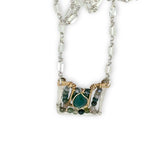 Sterling silver and brass hammered mini pendant holding green onyx and fancy jasper faceted gemstones on a sterling silver tube chain necklace