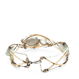 Sterling, darkened sterling, and bronze hammered waves form a cuff bracelet accented with moonstone, opal, fresh water pearl, and prehnite gemstones on gold filled wire