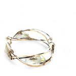 Sterling, darkened sterling, and bronze hammered waves form a cuff bracelet accented with moonstone, opal, fresh water pearl, and prehnite gemstones on gold filled wire