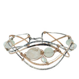 Sterling, darkened sterling, and bronze hammered waves form a cuff bracelet accented with moonstone, opal, fresh water pearl, and prehnite gemstones on gold filled wire