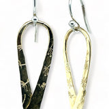 Stamped brass upside down teardrop earrings with blue crystal drop hanging from the bottom