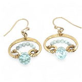 A pair of brass mini mushroom-shaped earrings with blue quartz gemstone drops and micro light blue cat's eye gemstones
