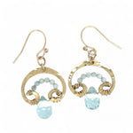 A pair of brass mini mushroom-shaped earrings with blue quartz gemstone drops and micro light blue cat's eye gemstones
